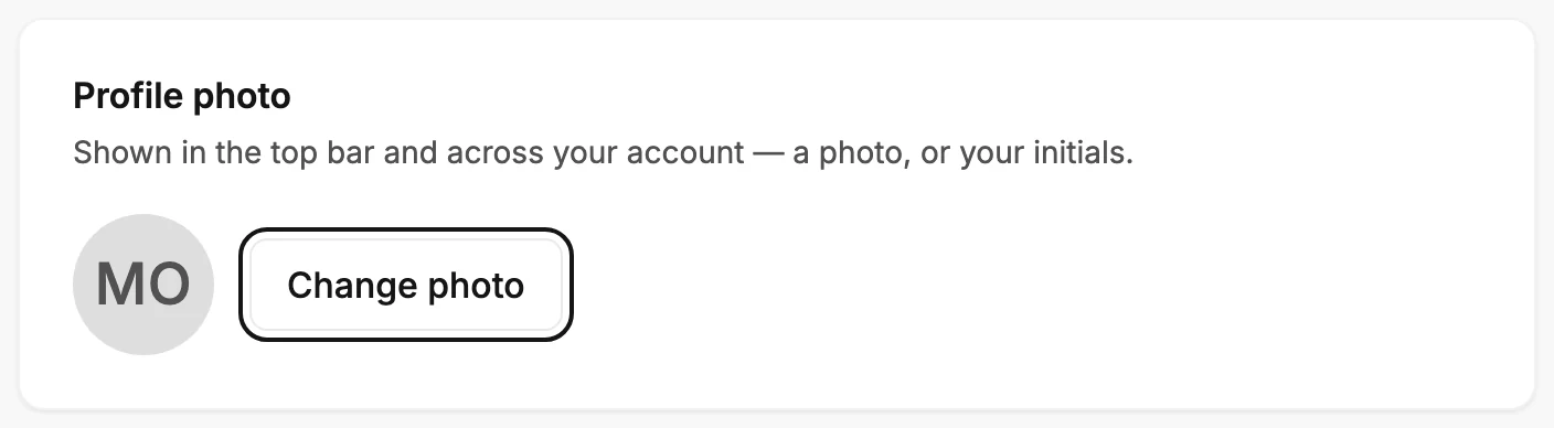 The Profile photo card with the current initials, the Change photo button ringed, and the card's own line about where the photo shows.