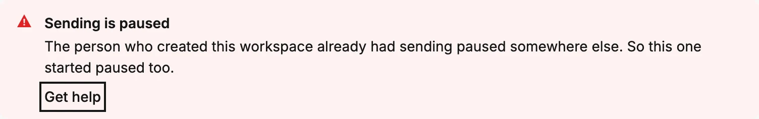 The red banner saying the person who created this workspace already had sending paused somewhere else, with its Get help link ringed.