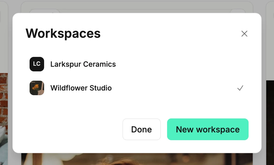 The Workspaces panel listing two workspaces, one with its initials and one with its icon, and a check mark beside the current one.
